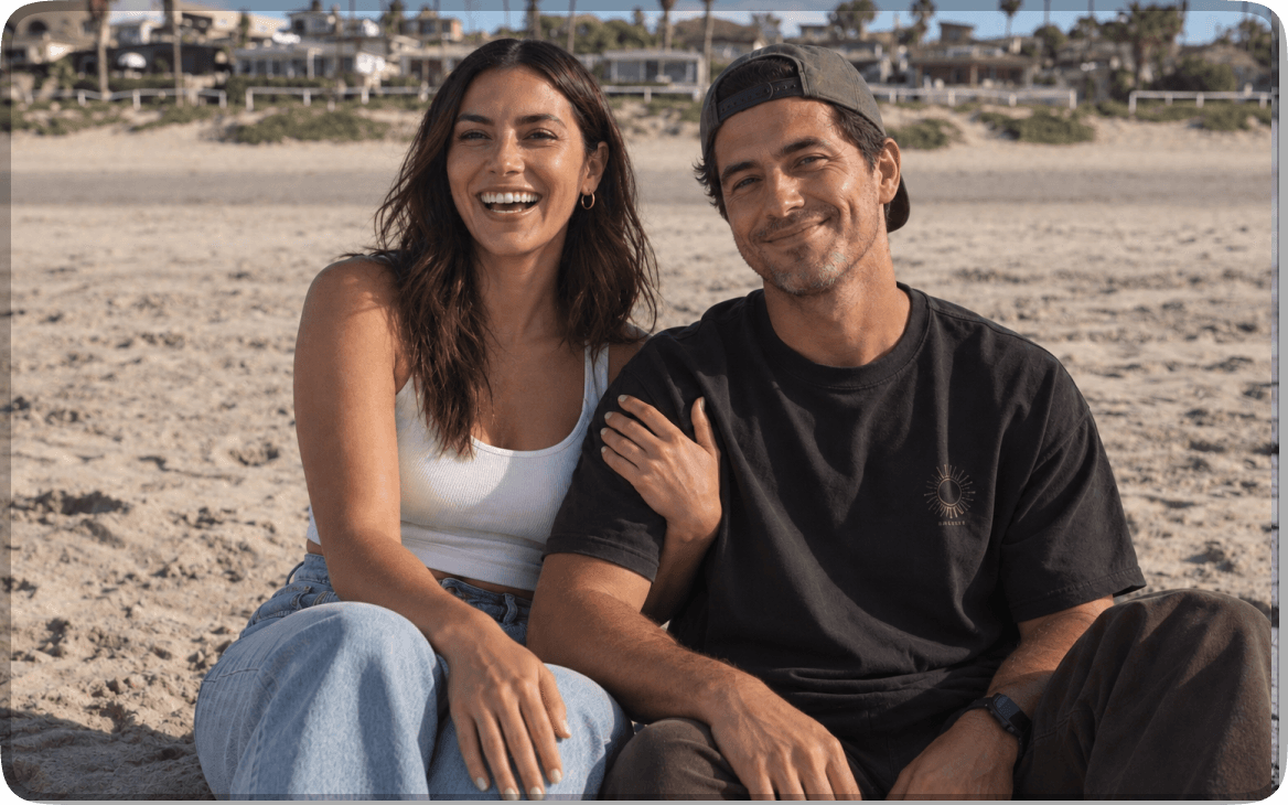 A couple sitting together on the beach